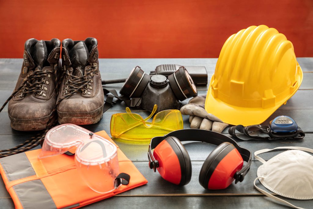 Safety equipment - comprehensive PPE collection including hard hat, safety boots, respirator, goggles, and protective gear